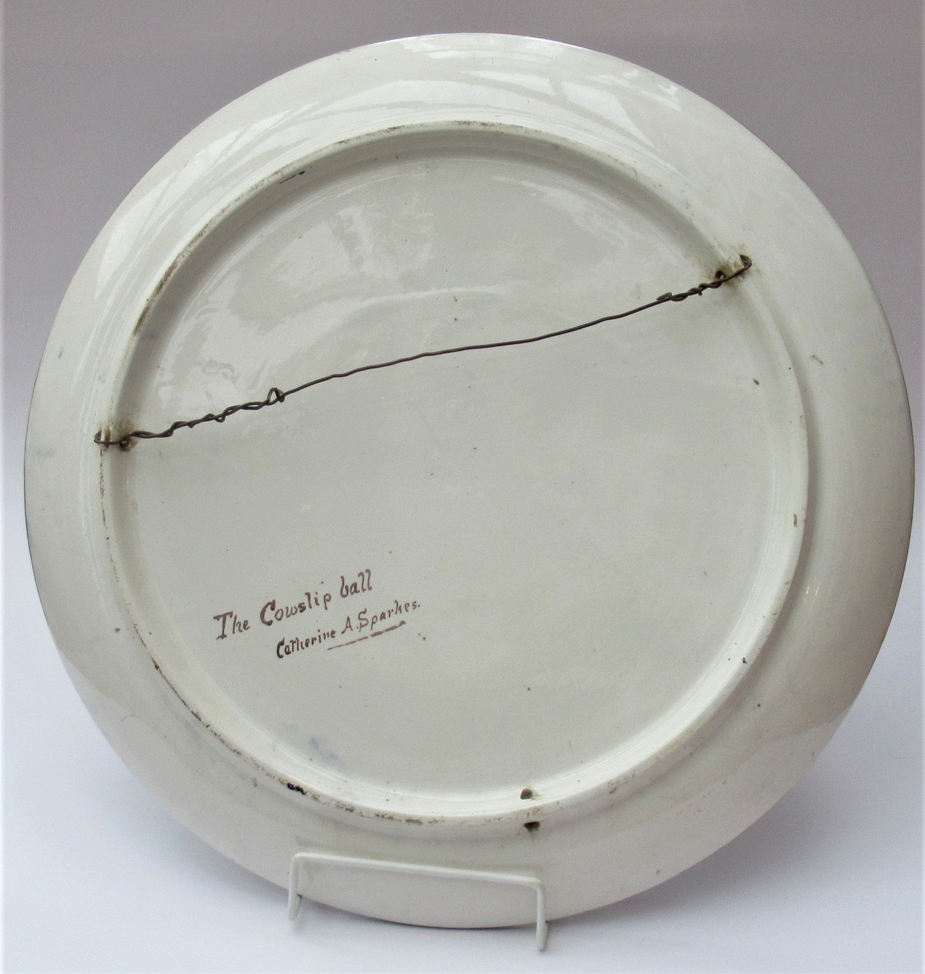 Large Arts and Crafts charger painted in 1877 by Catherine Sparkes, possibly for Doulton